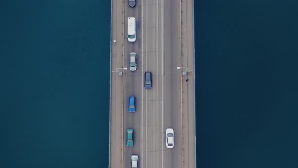 Traffic jam. Car traffic on the bridge over the river. Aerial view.