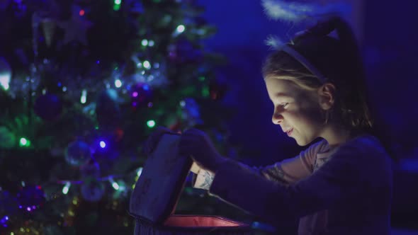 Child Opens a Glowing Gift