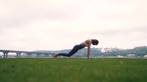 Girl Doing Fitness Exercises Outdoors