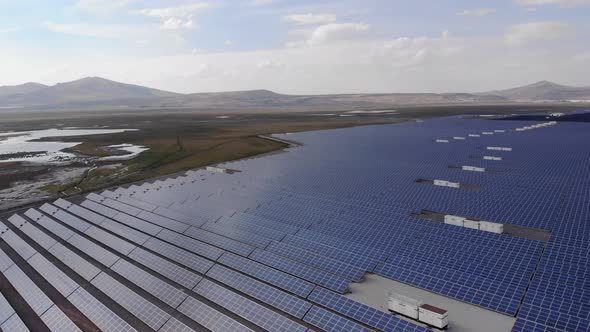 Aerial Shot of a Huge Solar Power Plant in a Big Field. Electricity Generation From Solar Energy