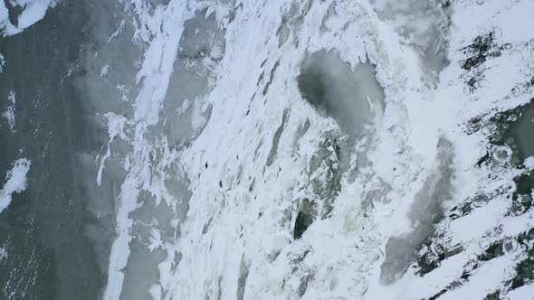 Flying Above Frosted Ice. Melting ice over warming water. Smooth ice with natural patterns.