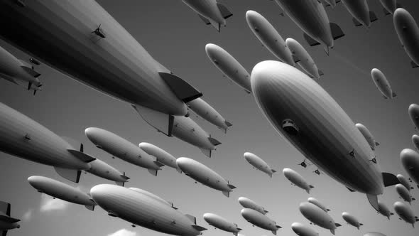 Large fleet of dirigibles. Airships are flying diagonally  across the frame.