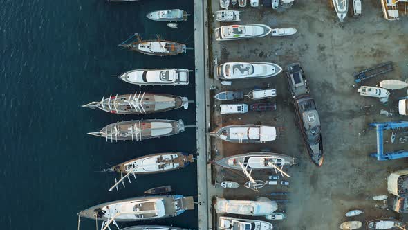 Yachts and Boats Moored at the Dock Shipyard. Aerial View From Above