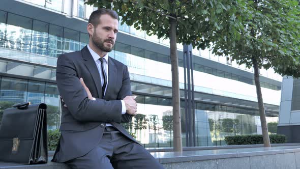 Tense Beard Businessman Outside Office