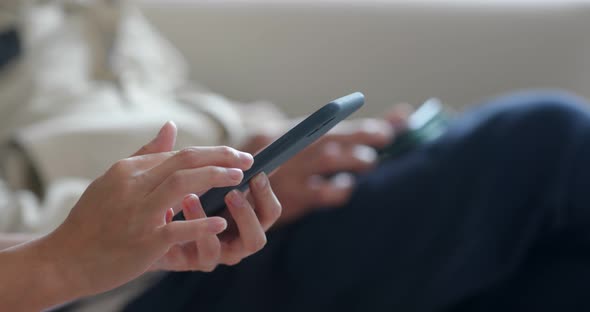 Woman use of mobile phone at home