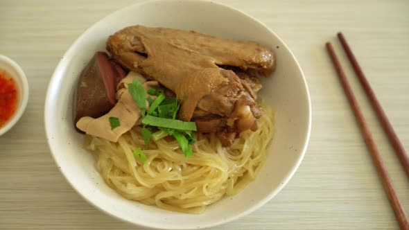 dried noodles with braised duck in white bowl - Asian food style