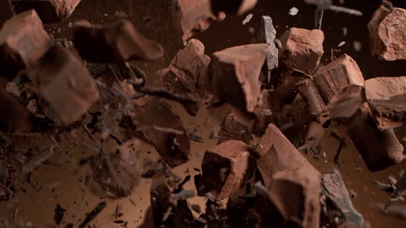 Super Slow Motion Shot of Raw Chocolate Chunks and Cocoa Powder after Being Exploded