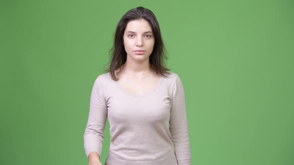 Young Beautiful Woman Covering Mouth As Three Wise Monkeys Concept