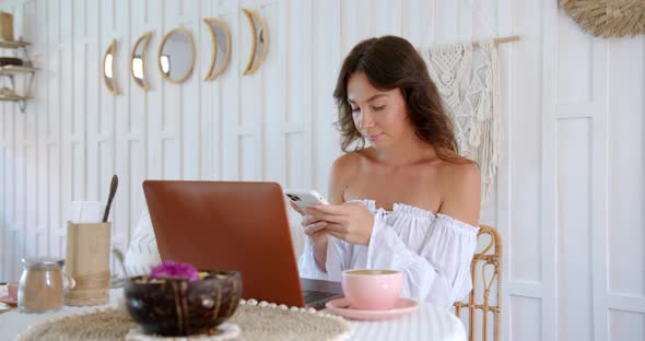 Bright Color Cafe Woman Typing the Massage She Freelancing While the Pandemic