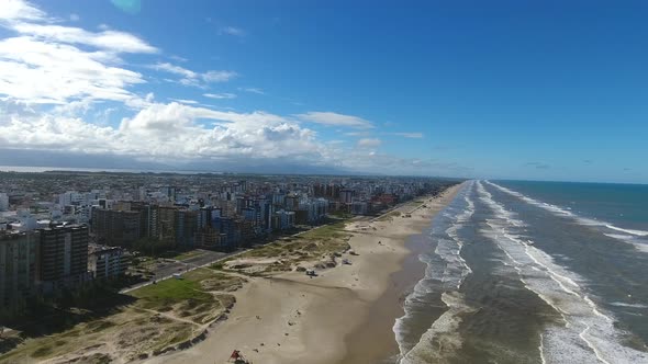 Beach and city, aerial scene in 4k, Capao da canoa city, south of Brazil.