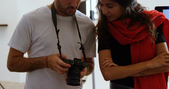 Male Photographer and Model Discussing Over Photos 4k