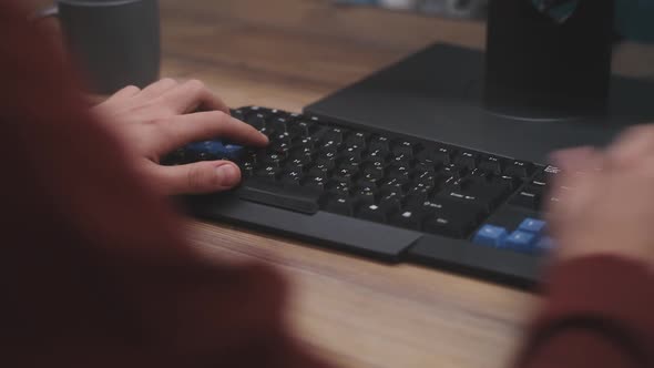 Crop Man Using Computer at Home