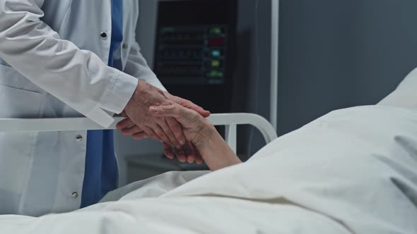 Doctor Holding Hand of Patient