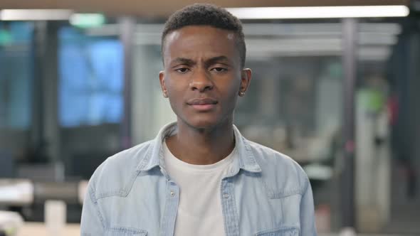 Portrait of African Man Crying towards Camera