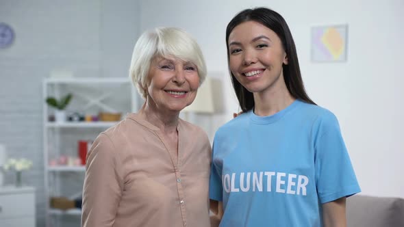 Happy Aged Woman and Female Volunteer Smiling on Camera, Old People Support