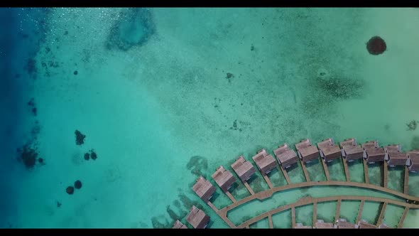 Aerial top view tourism of perfect seashore beach voyage by blue water with white sandy background o