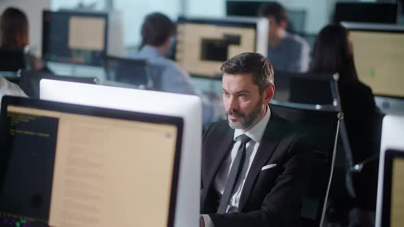 Professional Creative Businessman Working on Decktop Computer in Open Space Office 