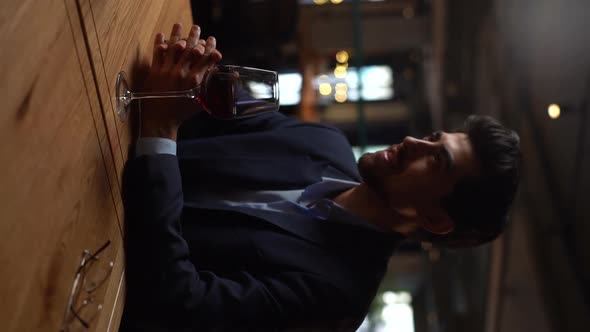 Vertical Shot of Handsome Bearded Man Wearing Suit Talking to Female Girlfriend at Date in