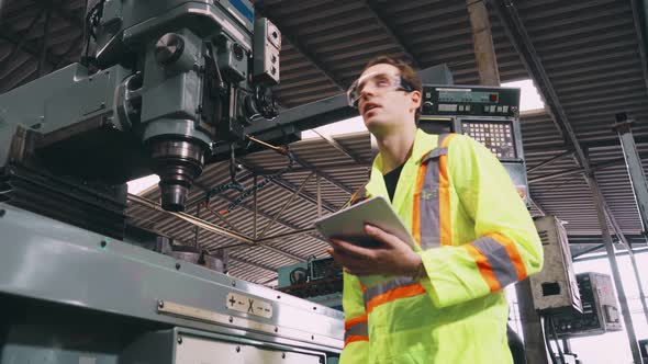 Factory Worker Warn Coworker About Safety and Give Hardhat to Him