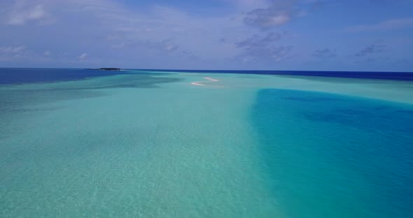 Wide angle overhead copy space shot of a summer white paradise sand beach and blue sea background in