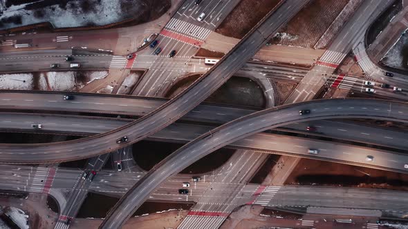 Aerial Flyover Traffic Jam Interchange Road in Winter Evening Drone Shot Top Down View Roadway