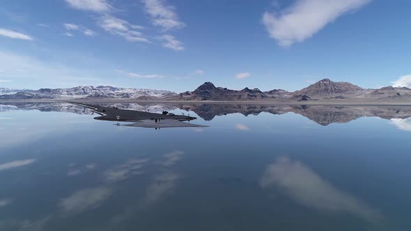 Rotating aerial view of water over the Bonneville Salt Flats