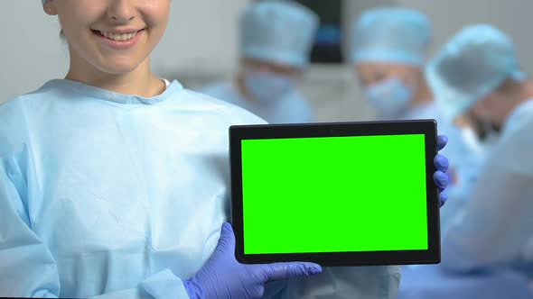 Smiling Medical Student Holding Tablet With Green Screen, Hospital Internship