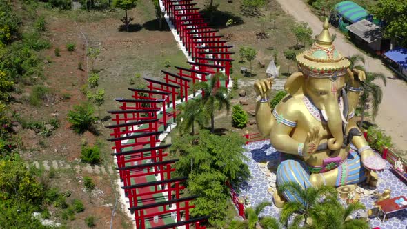 Wat Khao Sung Chaem Fa Temple with Giant Snake and Reclining Gold Buddha in Kanchanaburi Thailand