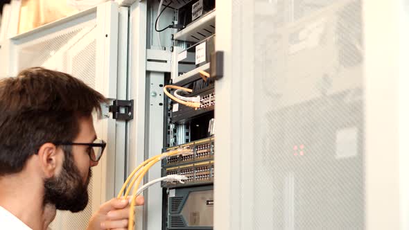 It Administrator In Mining Server Room And Connecting Ethernet Wire.Cloud Computing Mining Equipment