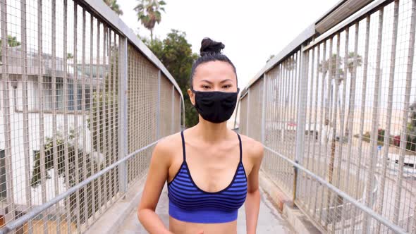 Athletic Asian woman going for her morning workout