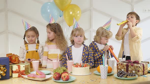 Caucasian Kids Celebrating Birthday at Home