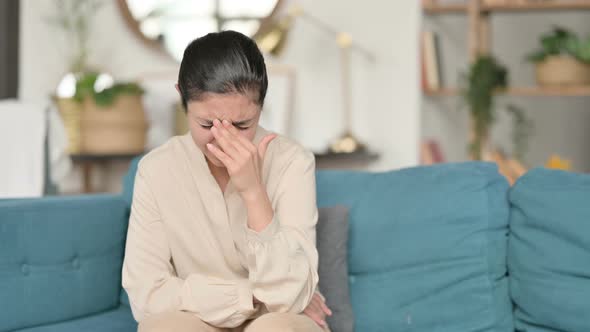 Indian Woman Sitting and Crying on Sofa 