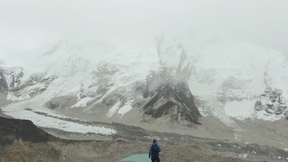 Man on Top of Kalapatthar Mountain. Everest and Nuptse. Nepal. Aerial View