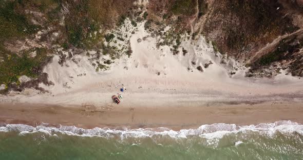 Top Down View of Waves Breaking in the Sand, Flying Over Tropical Sandy Beach and Waves