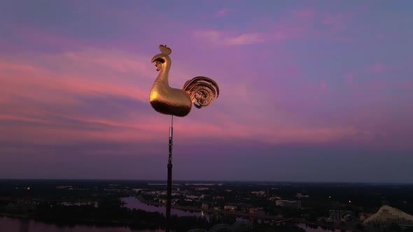 Aerial Close View of Golden Weather Cock or Rooster in Riga Old Town During Amazing Scenic Sunrise