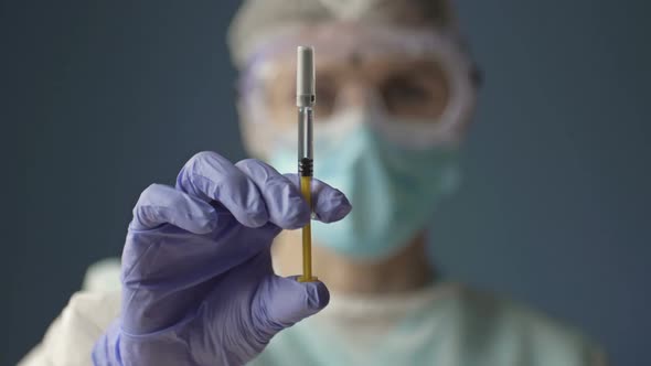 Syringe with COVID19 Vaccine in the Hands of a Nurse