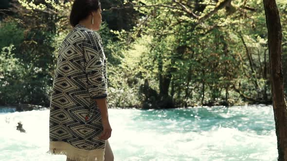 Woman Stands Near the Stream of a River, Lady Rejoices in a Beautiful Landscape