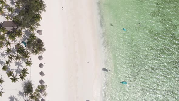 Zanzibar Tanzania  Vertical Video Kitesurfing Near the Shore of Ocean Slow Motion