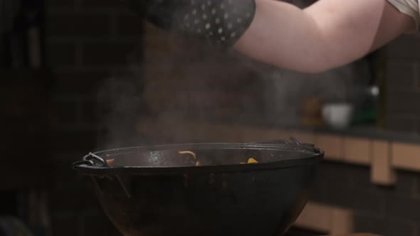 Chef Serves Dishes That Were Cooked in Cauldron or Large Castiron Frying Pan Opens Lids and Aromatic