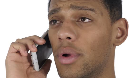 Close Up of AfroAmerican Man Talking on Smartphone with Customer