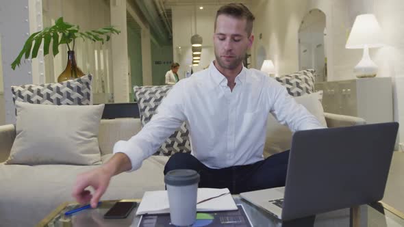 Businessman working on computer in modern office