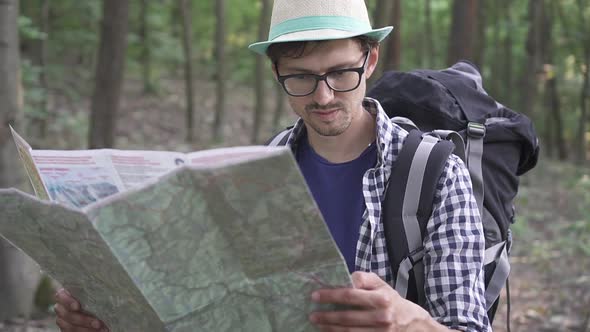 A Handsome Tourist Looks at the Map