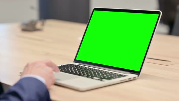 Old Businessman Using Laptop with Chroma Screen