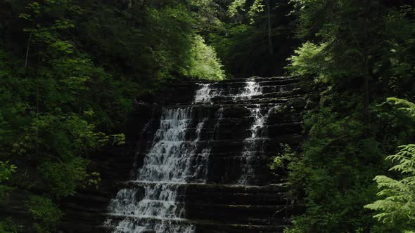 Aerial Drone View Waterfall in the Forest in Sunlight. V5