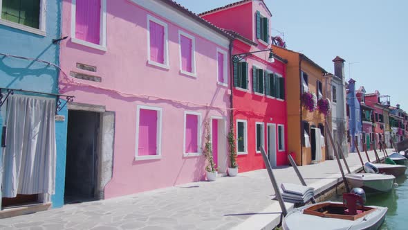 Multicolored Houses Stand Near Water Channel with Boats