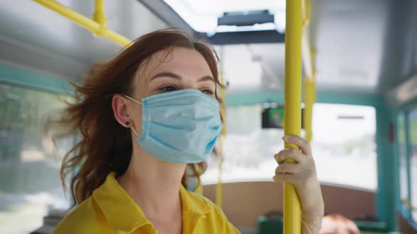 Joyful Girl City Transport Passenger Takes Off Medical Mask While Traveling on Bus, Safeguard