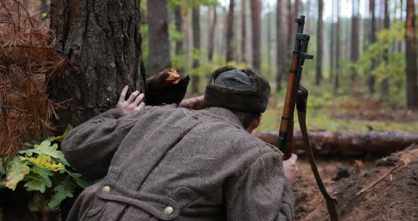 Hidden Reenactor Dressed Like Russian Soviet Infantry Red Army Soldier In World War II Sitting In