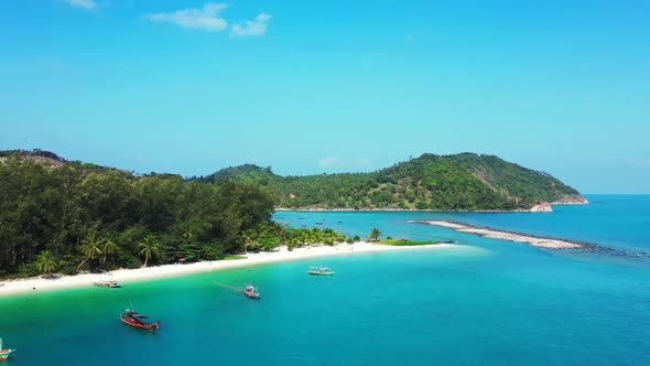 Aerial view tourism of tropical coast beach vacation by blue ocean with white sandy background of a 