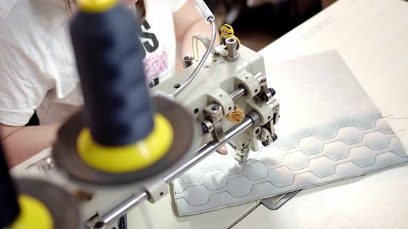 Close Up Process of Embroidering Diamond Pattern on Cowhide in Atelier on Step Sewing Machine