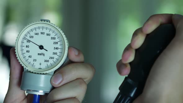 Doctor Measures The Blood Pressure